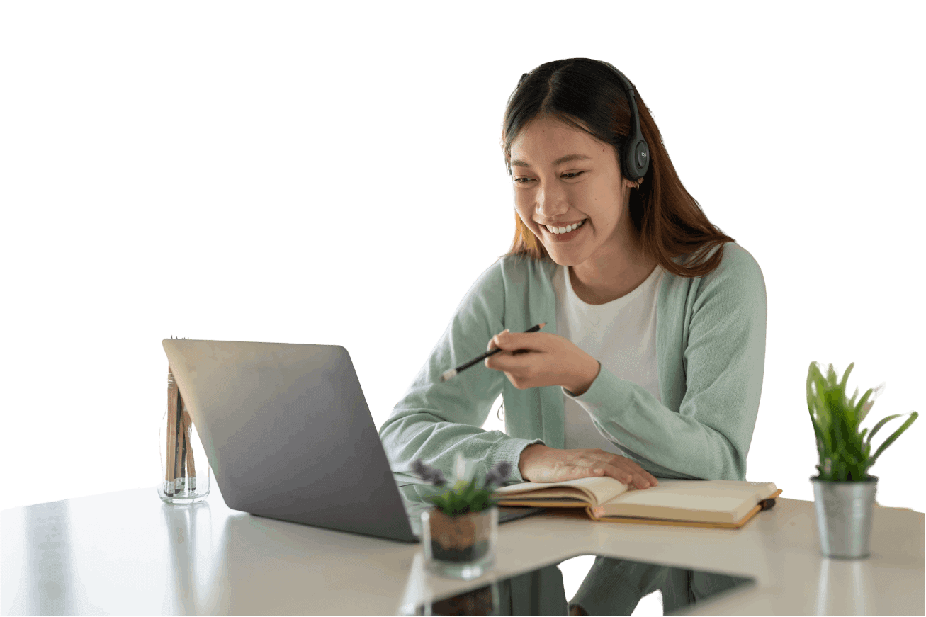 Smiling woman with a headset working on a laptop from home.